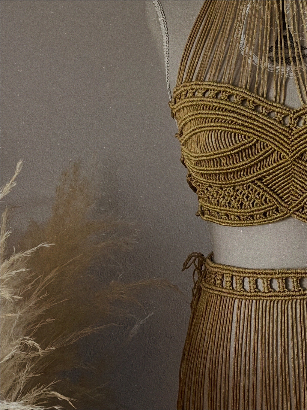 Details of a boho macrame set with macramé gold fringe 