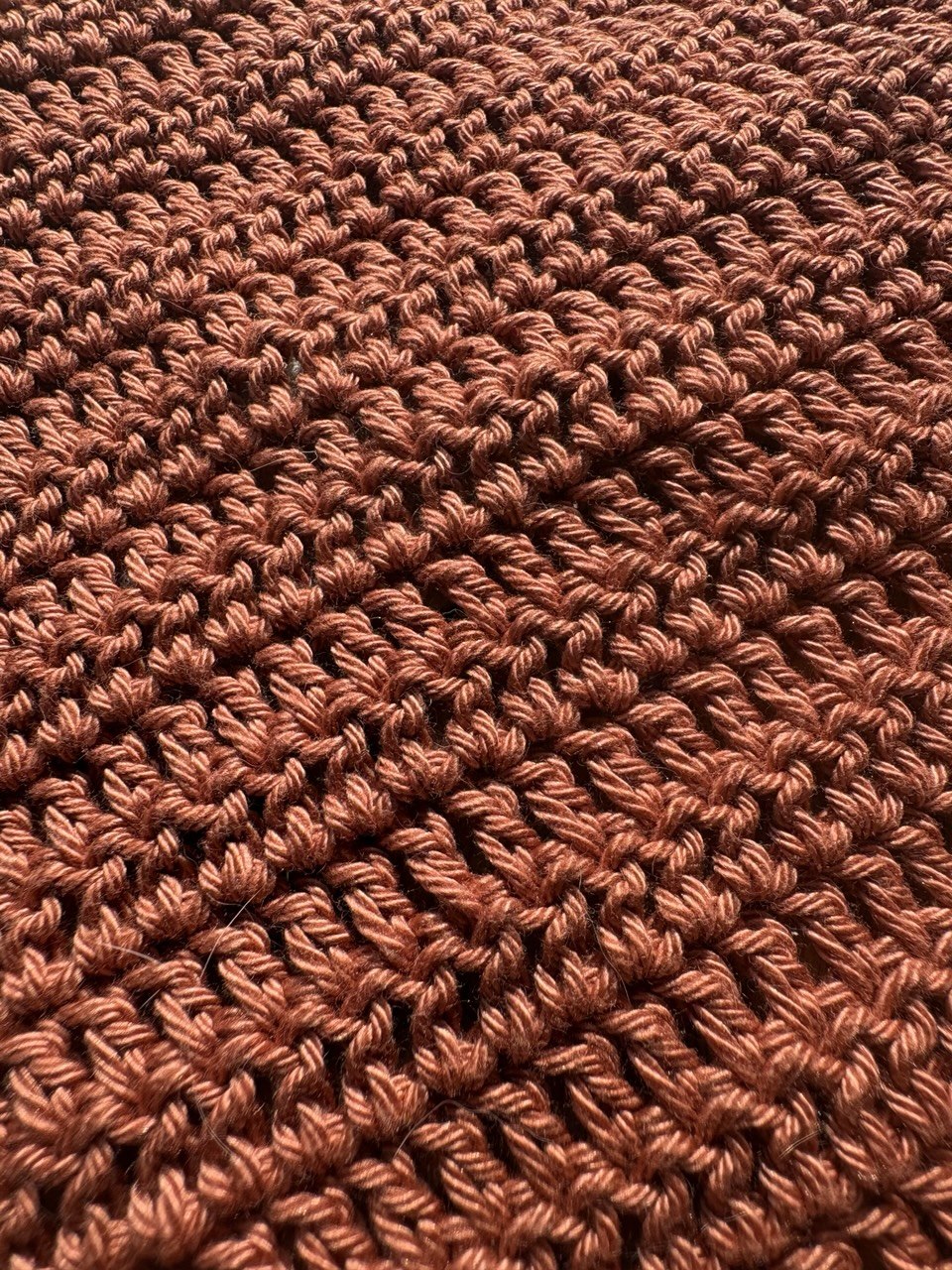 Close up of the details of the texture/pattern of the crochet top 
